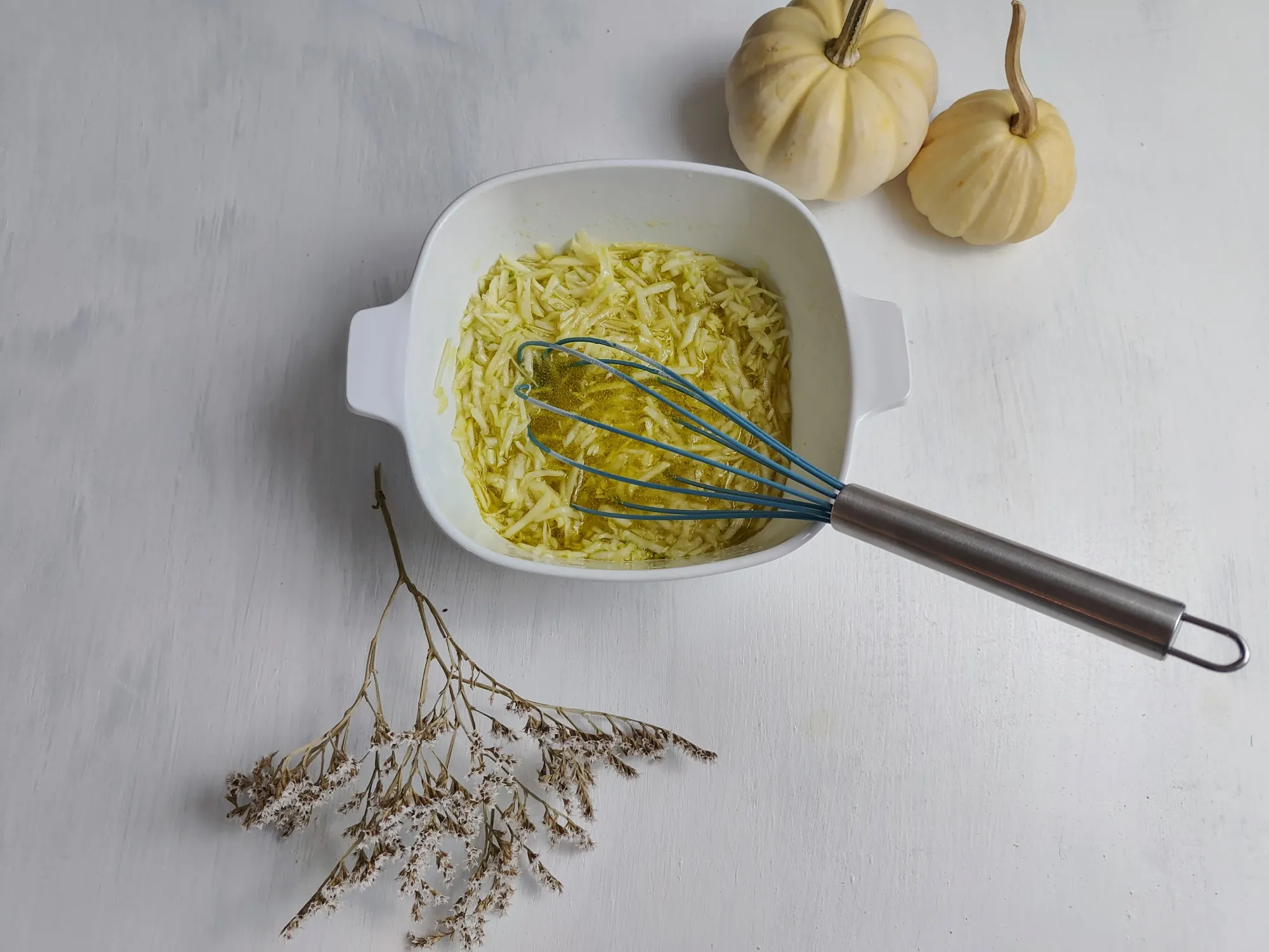 All of the wet ingredients in a bowl with a whisk