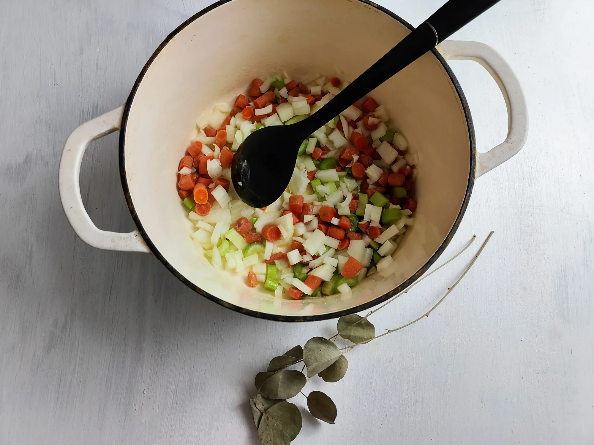 Carrots, celery, and onion in a dutch oven