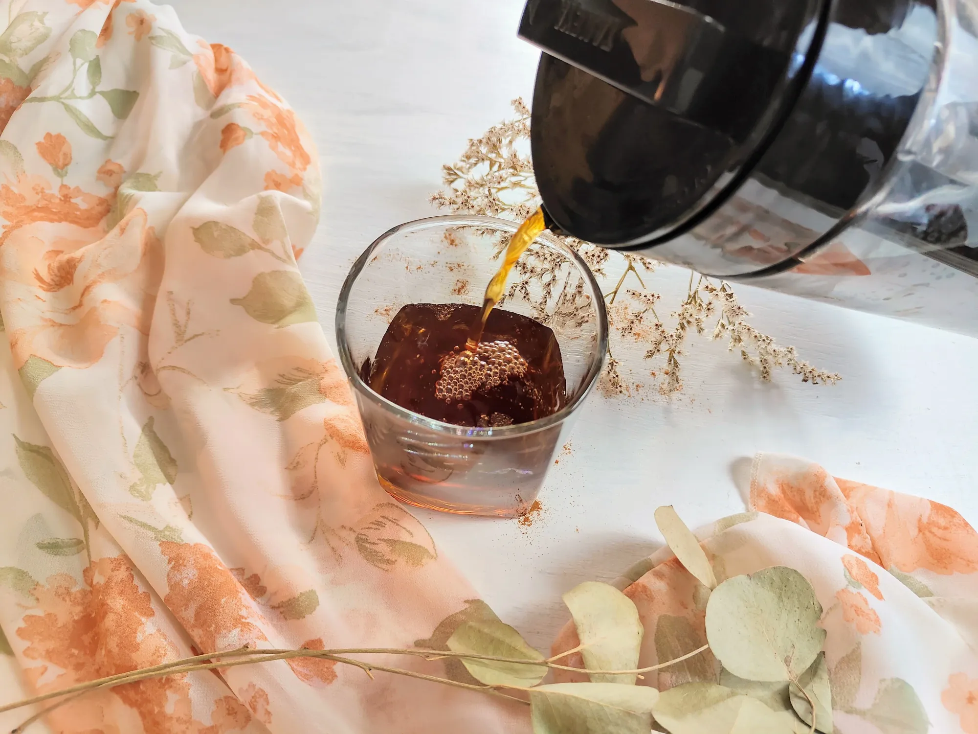 Cold brew coffee being poured into a glass