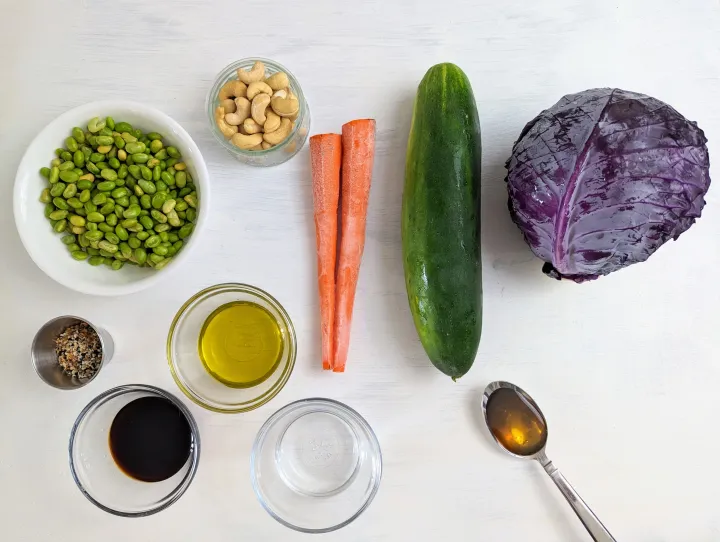 An assortment of vegetables, beans, nuts, and seasonings. 